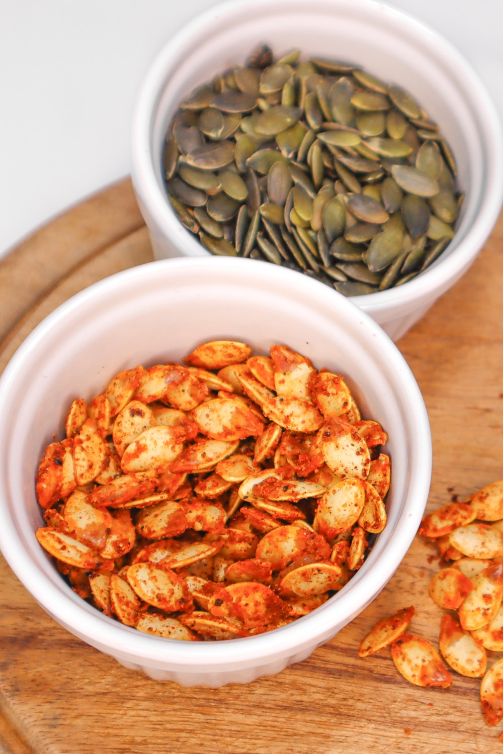 Roasted-pumpkin-seeds-pin-01 Roasted spiced Pumpkin Seeds in a small bowl
