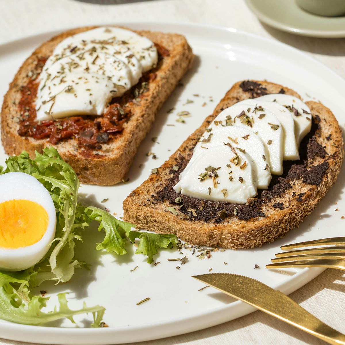 Tapenades spread on bread with egg