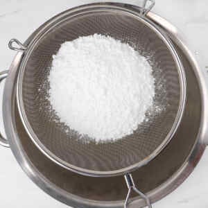 Icing sugar in a sieve