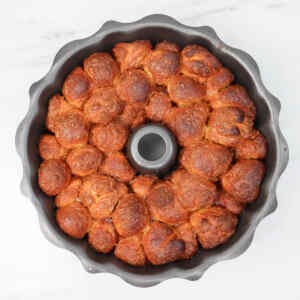 Golden brown pull-apart monkey bread in a bundt pan, showcasing its fluffy texture.