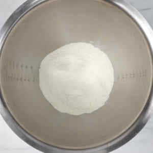 A bowl filled with flour, ready for making pull-apart monkey bread.