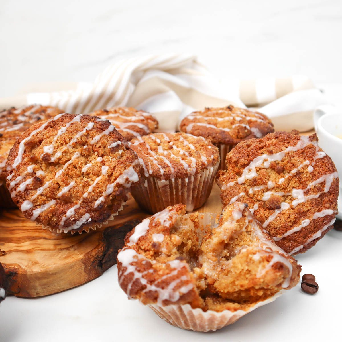 Coffee Cake Breakfast Muffins Freshly baked coffee cake breakfast muffins with a crumbly topping and glaze.