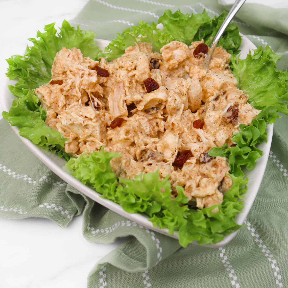 Coronation Chicken A creamy coronation chicken salad served on a bed of fresh lettuce.
