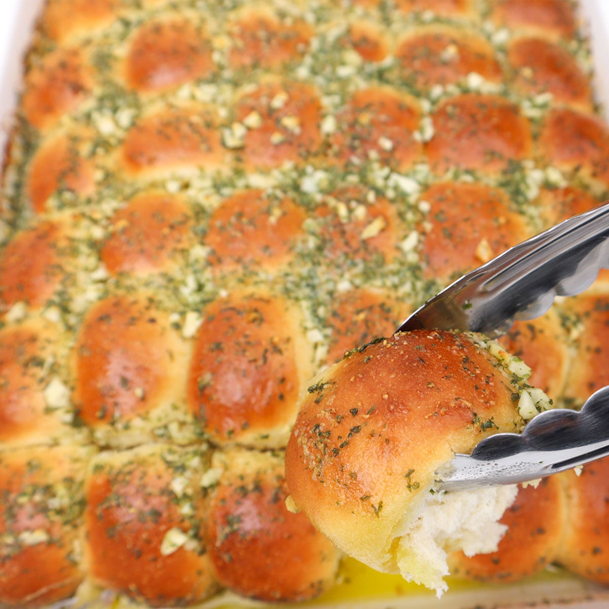Garlic Dough Balls Golden garlic dough balls topped with herbs, ready to be served.