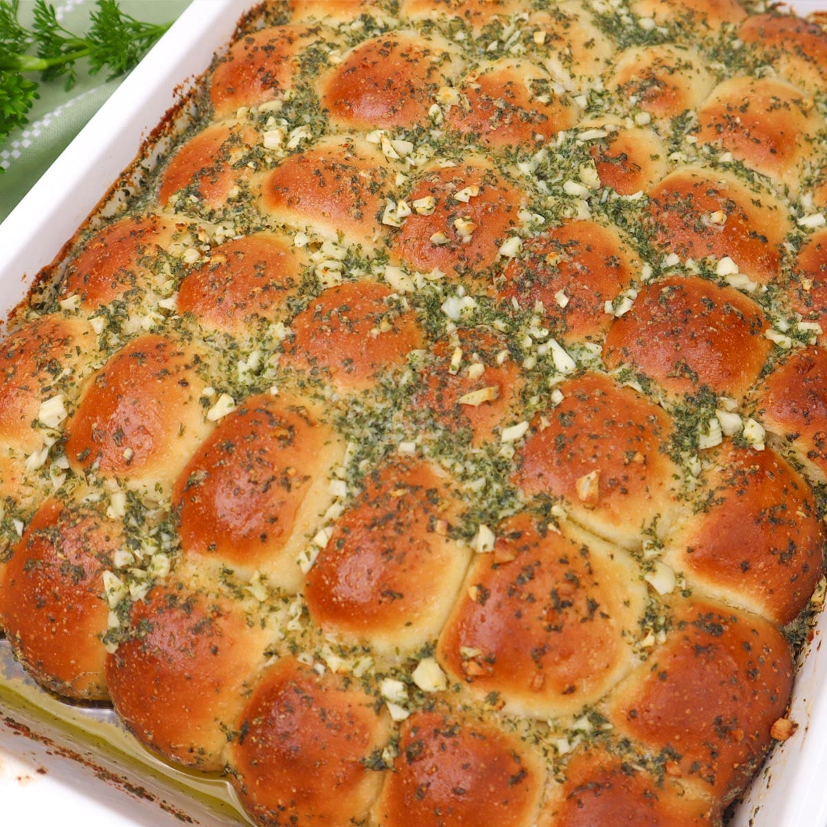 Garlic Dough Balls Golden garlic dough balls topped with herbs, baked until fluffy and golden brown.