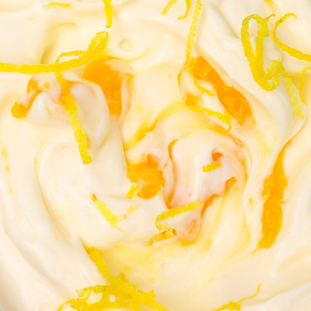 Lemon Ice Cream Creamy lemon ice cream swirled with lemon curd and garnished with lemon zest.