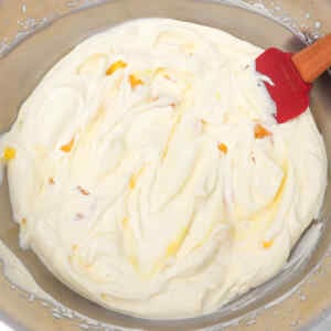Creamy lemon ice cream mixture in a bowl, ready to be frozen.