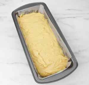 Batter for lemon drizzle cake in a loaf pan, ready for baking.