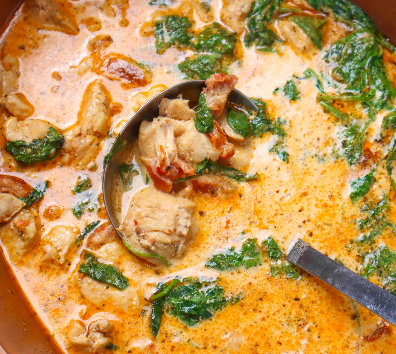 Slow Cooker Marry Me Chicken Creamy slow cooker chicken with spinach and sun-dried tomatoes in a pot.